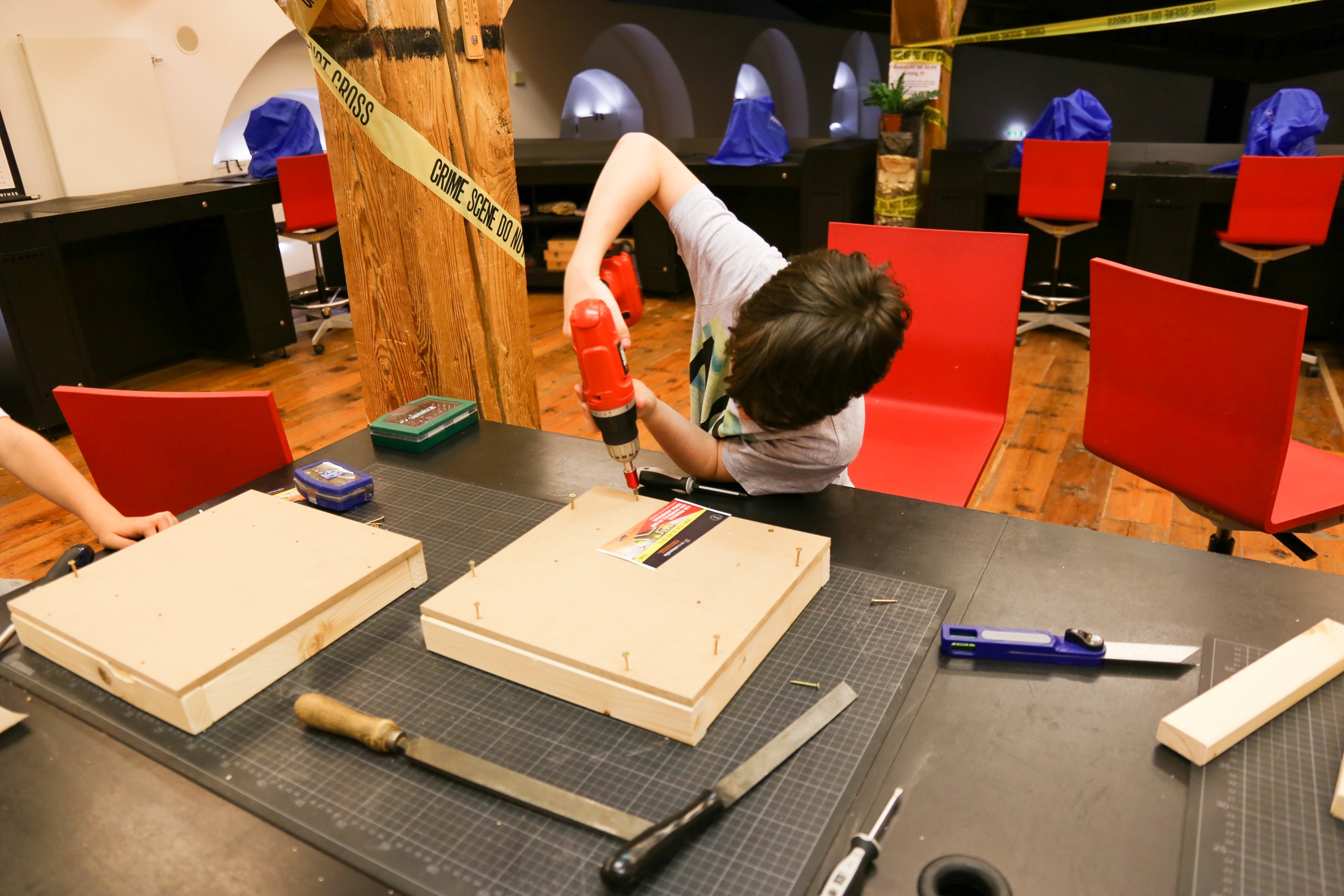 Child builds a wooden box